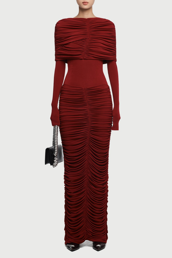 Red ruched dress with a handbag on a white background